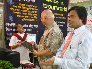 Finance Minister AMA Muhith handed over Computers to the Awardee of Digital Young Star Award as Chief Guest; Dr. M Helal is presiding over. (2010)